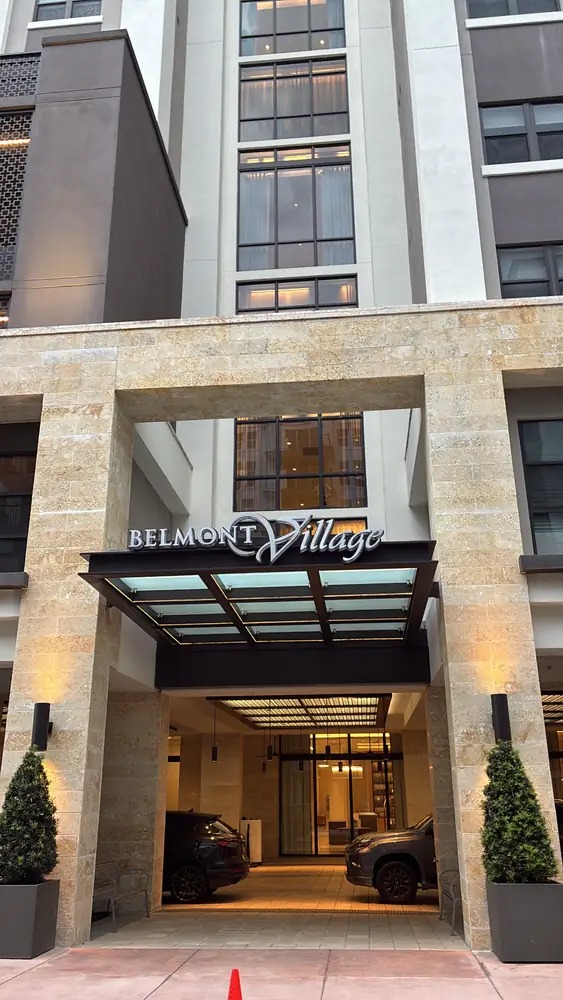 The same Coral Gables coral stone entrance after drone facade cleaning, with the stone brightened and staining removed