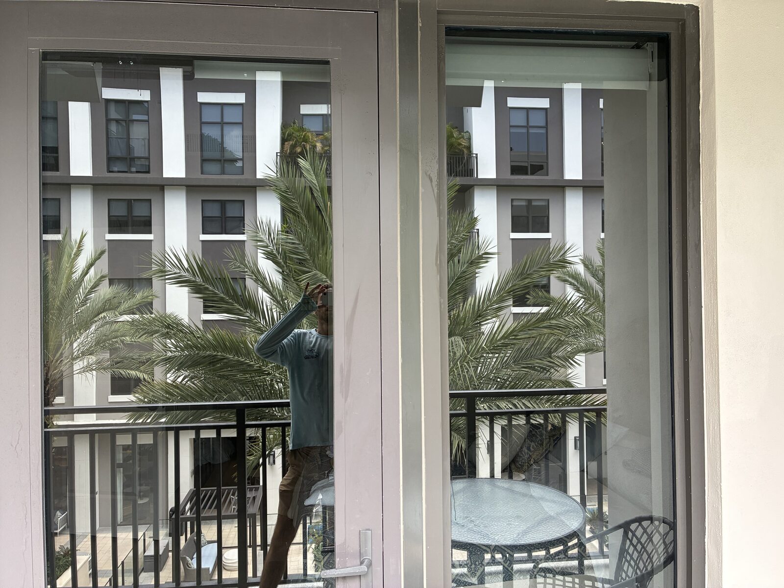 Streak-free high-rise windows overlooking the courtyard in Coral Gables