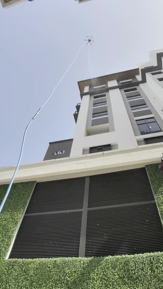 Rising past the living green wall & sun-screens