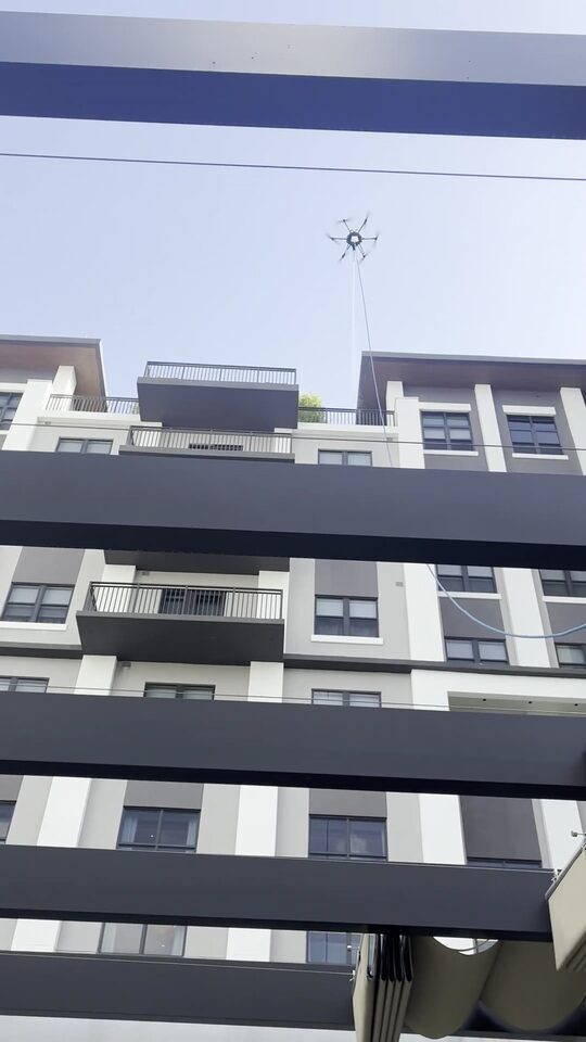 Drone over the amenity courtyard & pergola