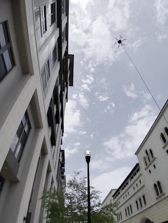 Flying along the high-rise facade