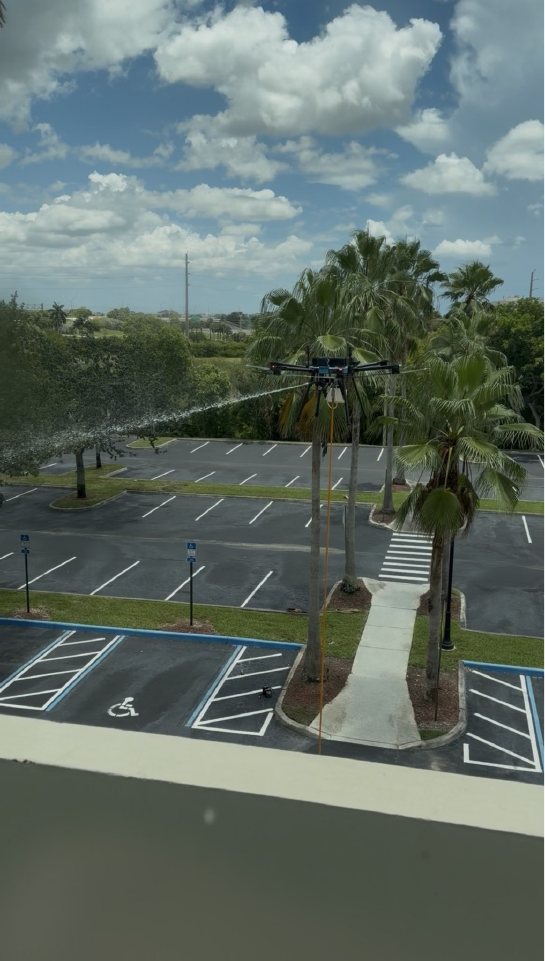 The tethered cleaning drone at work above the Miramar Centre II parking lot