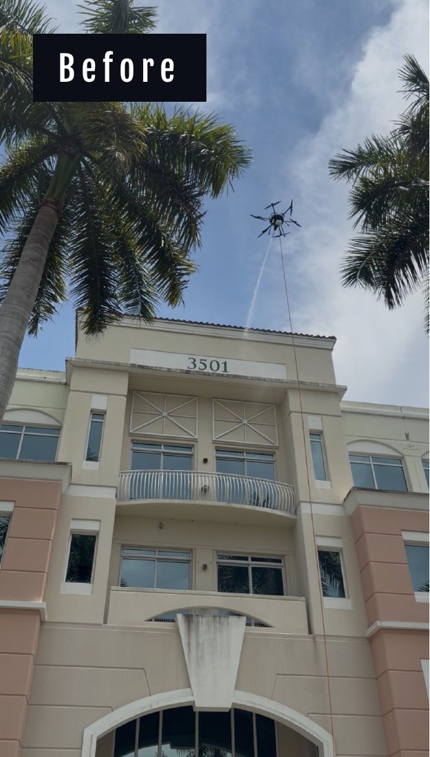 The 3501 tower of Miramar Centre II before cleaning, with the drone starting work above the entrance