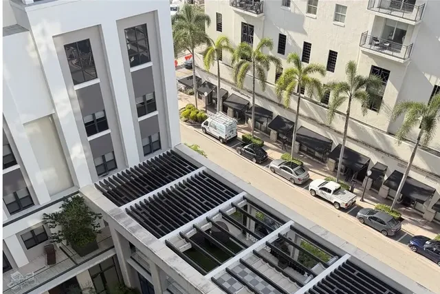 Before, roof-level pergola, parapet and decks at Belmont Village, Coral Gables, drone soft wash